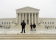 Supreme Court police stand guard during a storm in March.